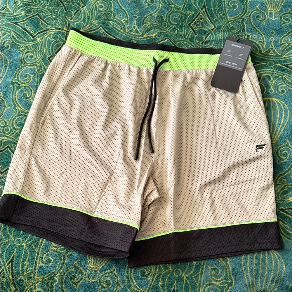 Fabletics Men's Beige and Black Athletic Shorts with Neon Green Accents